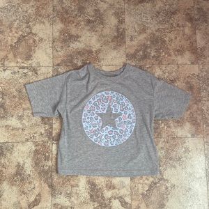 This is a new only worn once gray Chuck Taylor Converse cropped top in a size M.